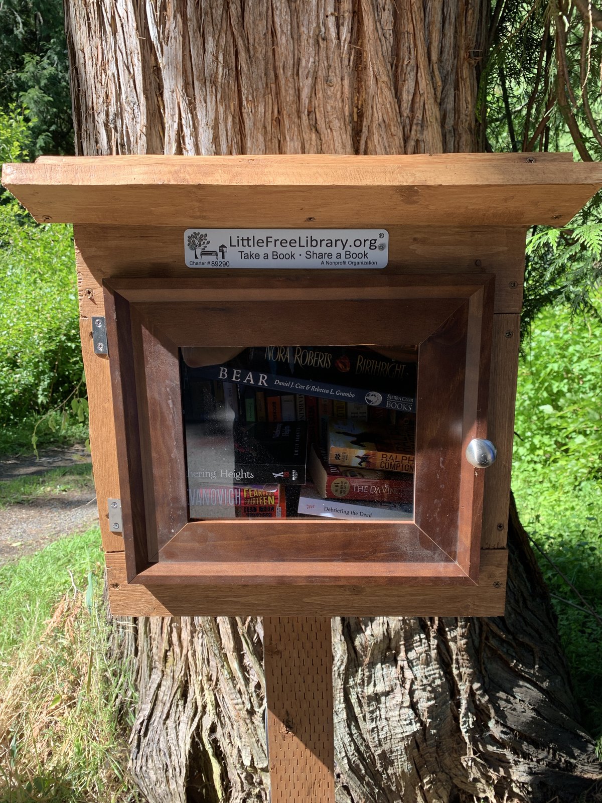 A free little library, registered with LittleFreeLibrary.org (Charter #89290) in front of our property.