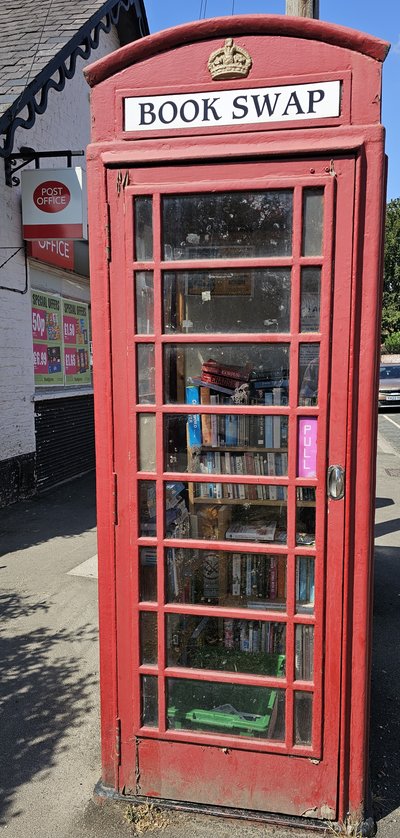 Community book swap within disused phone box in Cherry Burton outside the Post Office